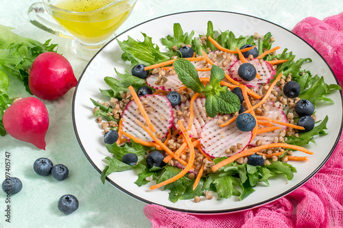 Vitamin vegetarian salad with buckwheat, vegetables and blueberries