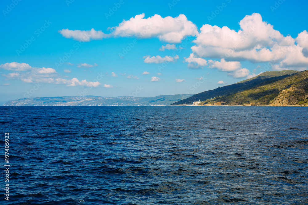 Athos peninsula, Greece.View from a ferry. Orthodox monasteries, mountains Athos peninsula, Greece.View from a ferry. Orthodox monasteries, mountains