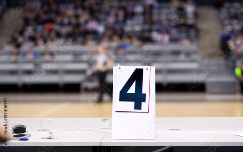 fourth quarter of basketball game sign on table