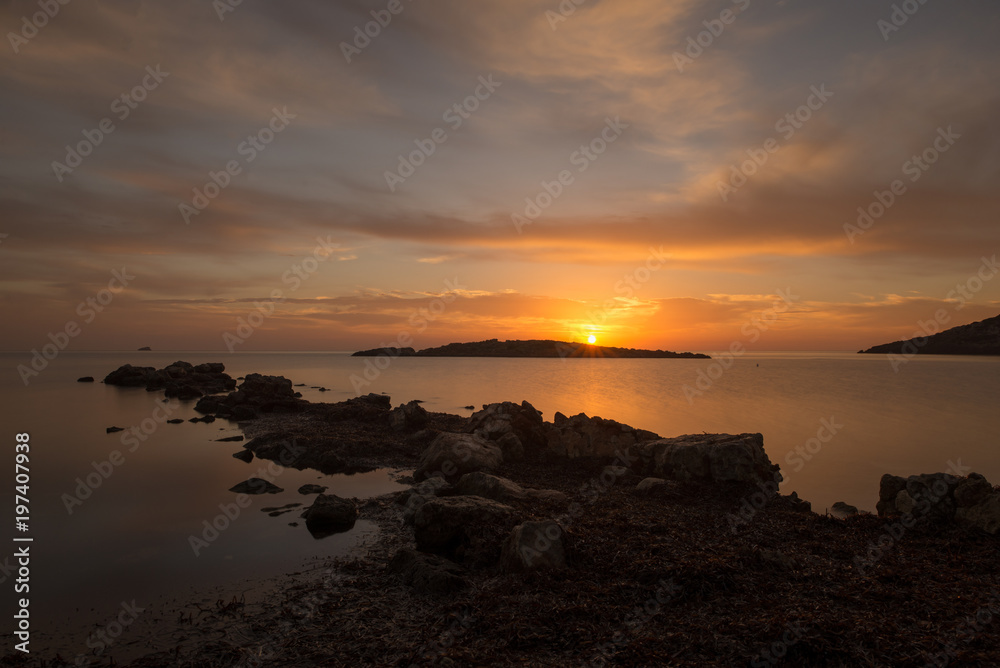 Fototapeta premium Cala de Sal rossa at sunrise in Ibiza