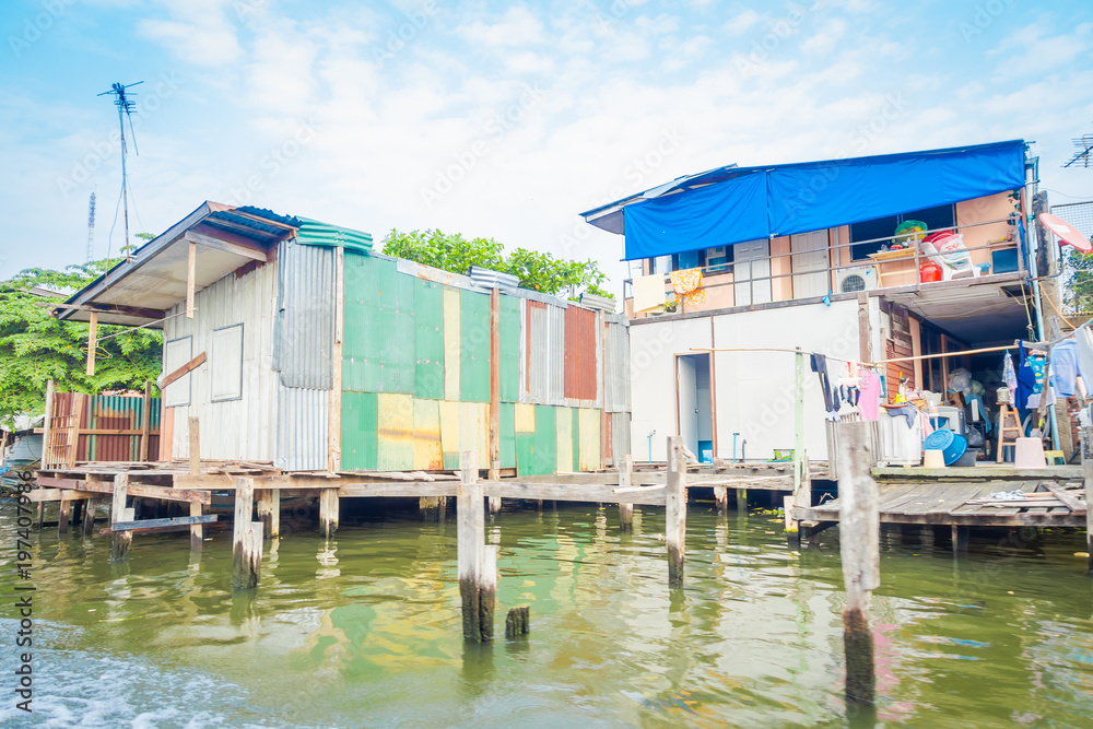 Outdoor view of floating poor house on the Chao Phraya river. Thailand, Bangkok Outdoor view of floating poor house on the Chao Phraya river. Thailand, Bangkok