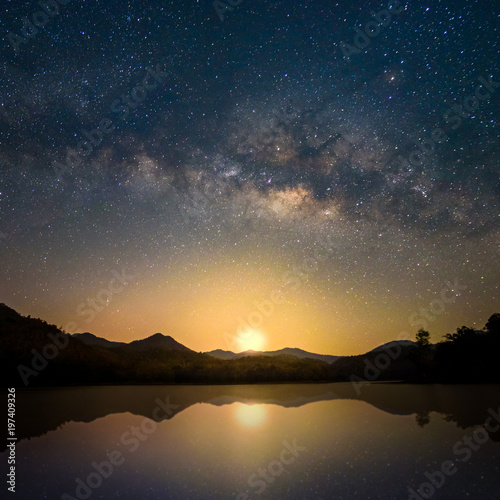 Beautiful Milky Way Reflection on Lake in morning with first light of sunrise, Chiang mai , Thailand © jaboo_foto