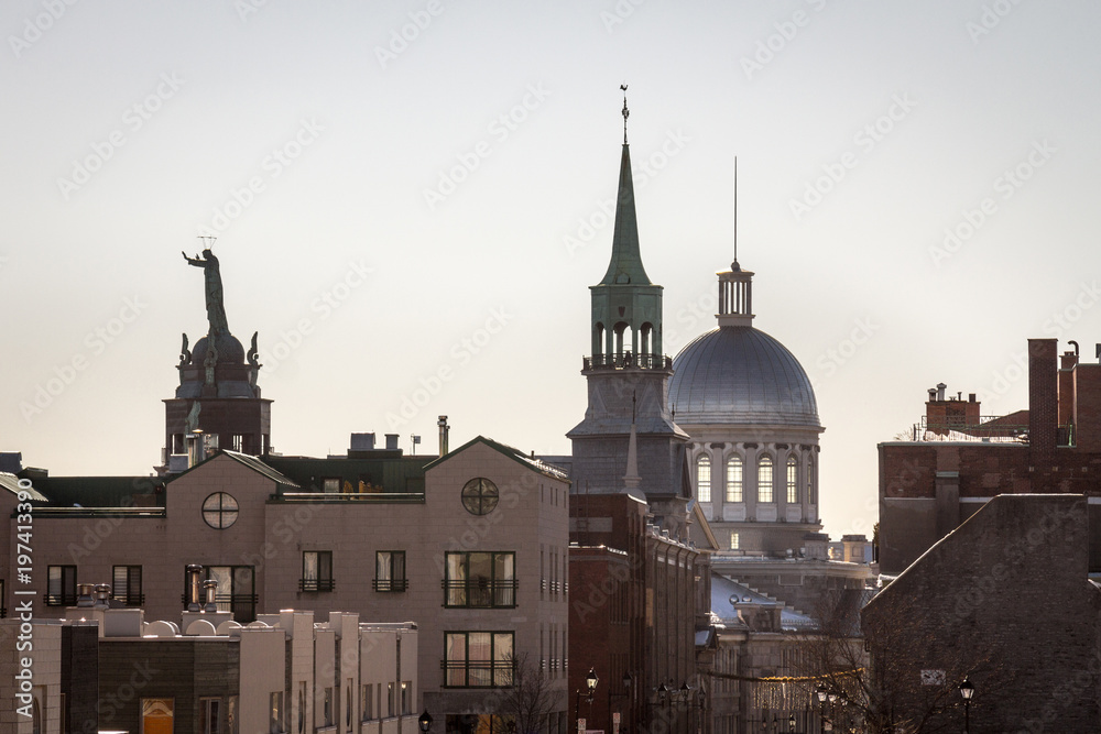 Fototapeta premium Marche Bonsecours in Montreal, Quebec, Canada, into the light during a winter morning, surrounded by other historical buildings. Bonsecours Market is one of the main attractions of Old Montreal