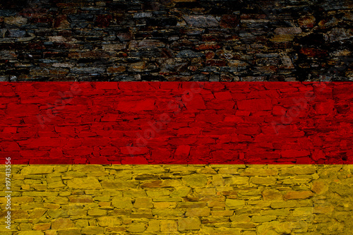 Germany (in German, Bundesrepublik Deutschland) national flag painted on a brick wall. Concept image for Germany and the German language and culture.
