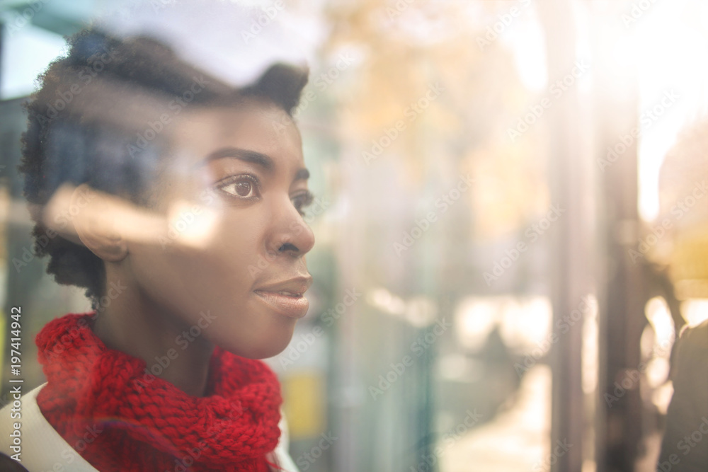Portrait of a girl looking through a window Portrait of a girl looking through a window