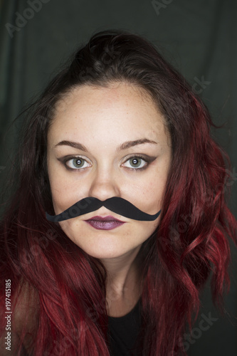 young woman with mustache