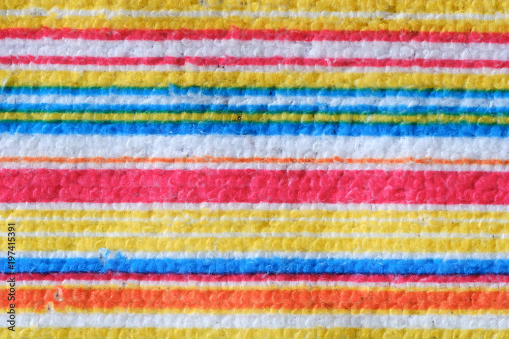 Striped beach towel useful as a background pattern