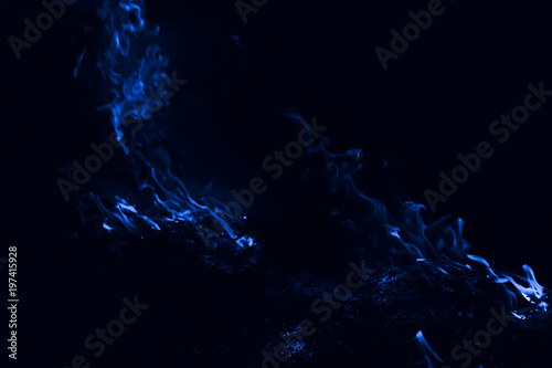Fototapeta Naklejka Na Ścianę i Meble -  Blue flame. Fire. Burning of rice straw at night.