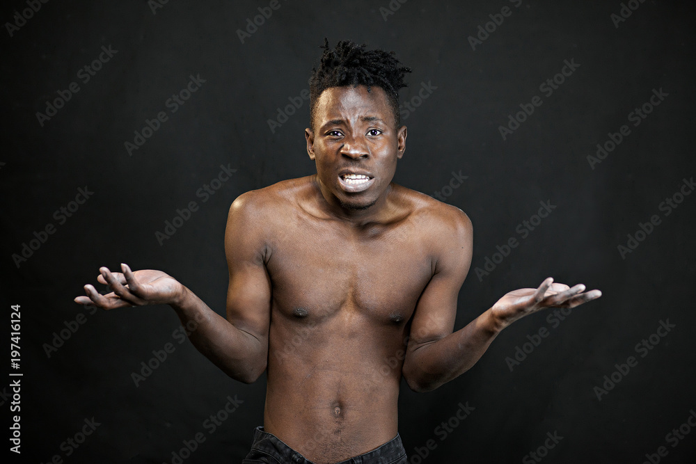 Fototapeta premium emotions black young man on a black background
