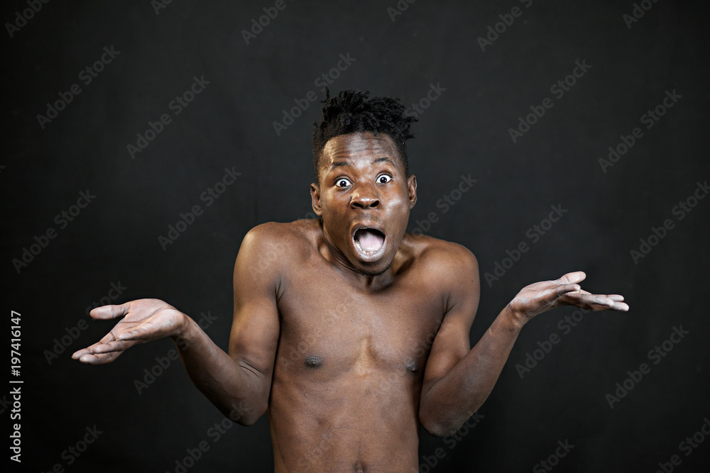 Obraz premium emotions black young man on a black background