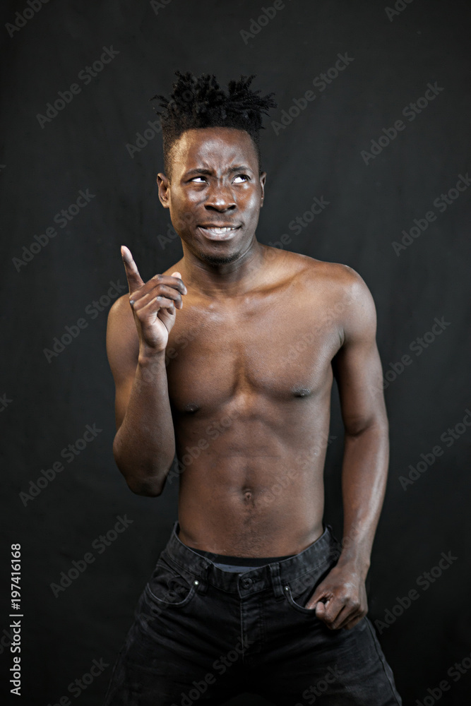Obraz premium emotions black young man on a black background