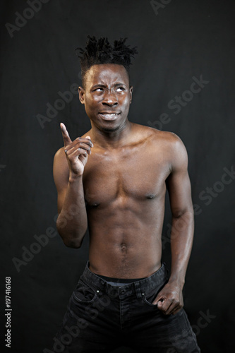 emotions black young man on a black background