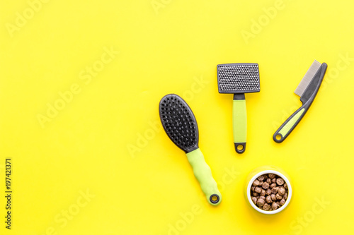 cats and dogs toys and acessories for pets yellow background top view mockup