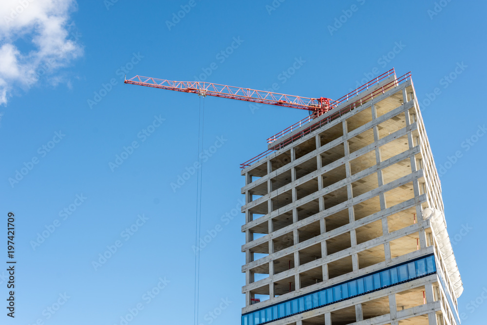 Construction Site With Crane On Blue Sky - Modern Office And Residential Building Under Construction Construction Site With Crane On Blue Sky - Modern Office And Residential Building Under Construction