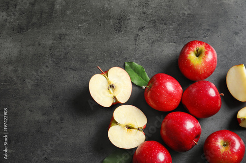 Fototapeta Naklejka Na Ścianę i Meble -  Fresh ripe red apples on grey background, top view