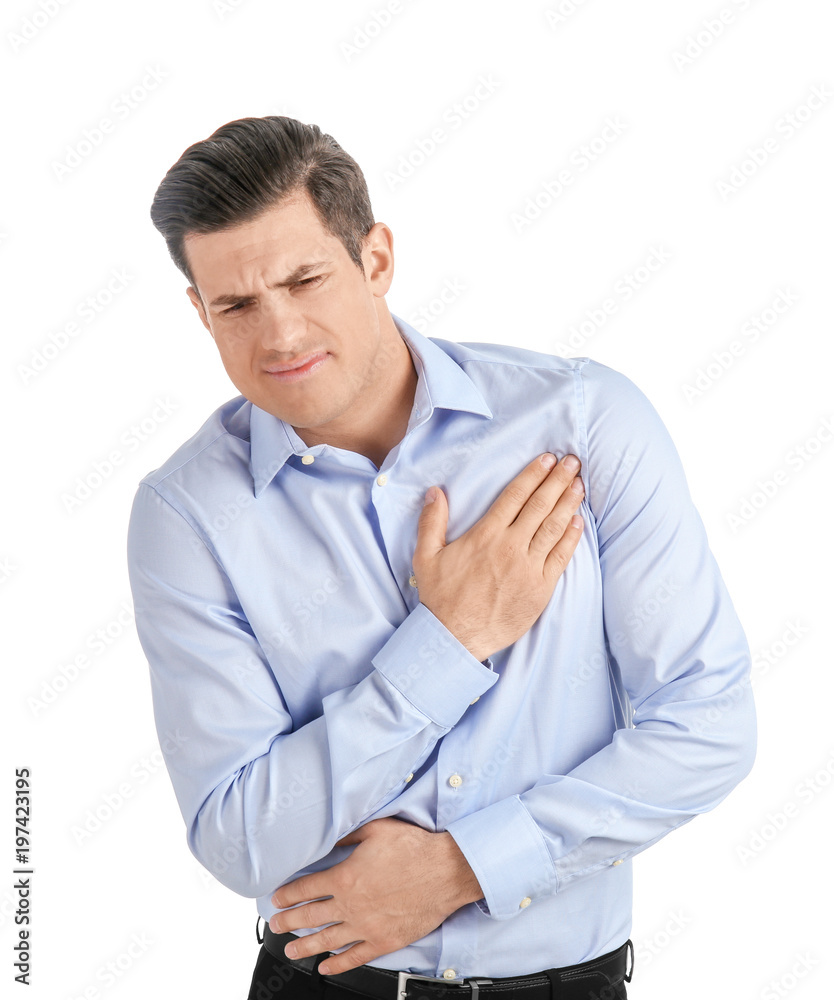 Young man suffering from chest pain on white background Young man suffering from chest pain on white background