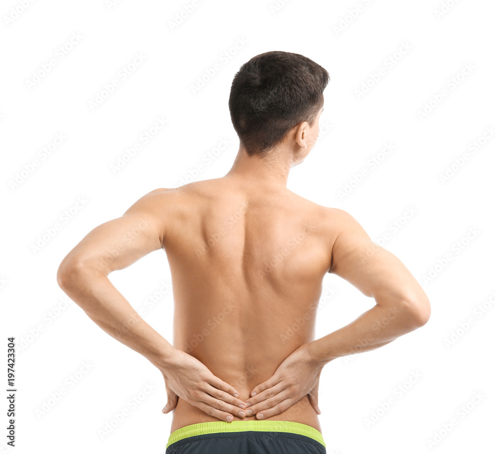 Young man suffering from back pain on white background Young man suffering from back pain on white background