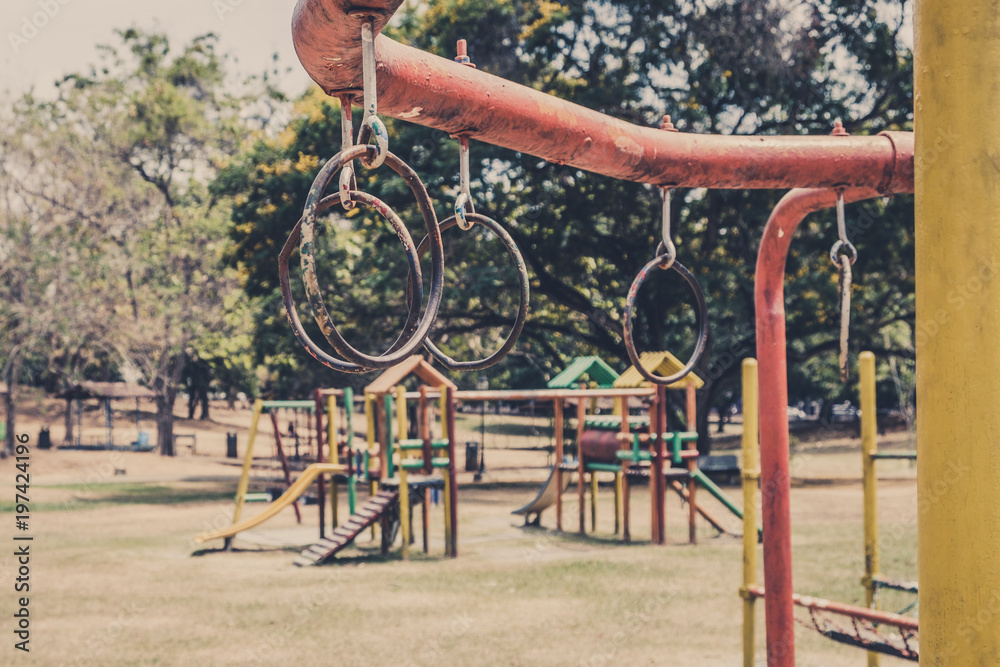 rings hanging on climbing frame - jungle gym on old outdoor playground rings hanging on climbing frame - jungle gym on old outdoor playground