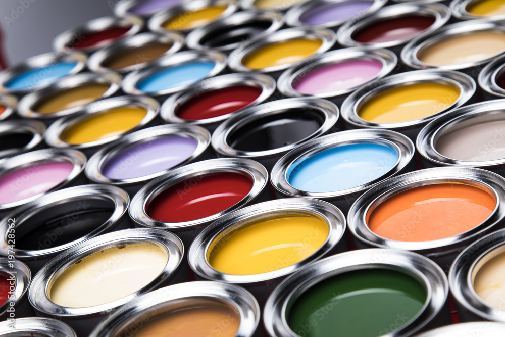 Fototapeta premium Buckets full of rainbow colored oil paint