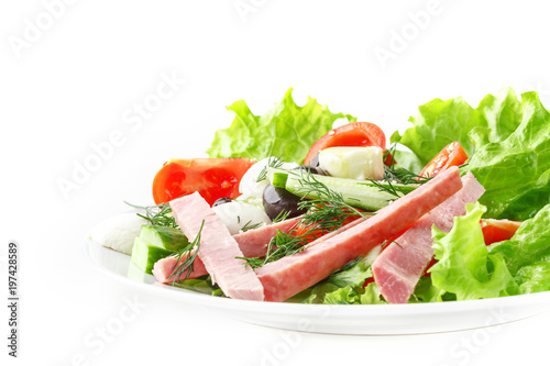 Fresh vegetable salad in a plate. Restaurant serving. Isolated.