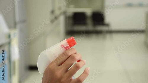 Closeup of water spraying tool nozzle with 70% ethanol alcohol for cleaning and hygiene in science laboratory.
