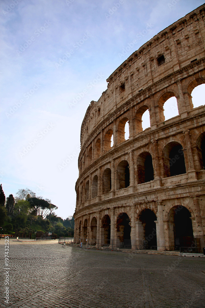 Ancient Roman Coliseum against a blue summer sky