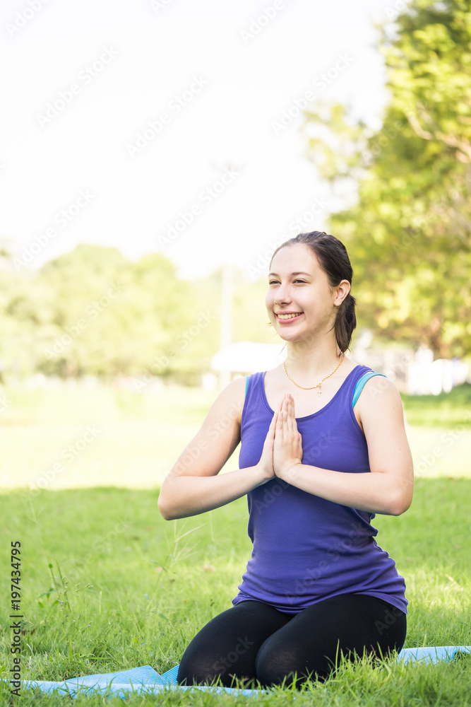 Beautiful woman doing yoga exercises in the park. Concept of healthy lifestyle. Beautiful woman doing yoga exercises in the park. Concept of healthy lifestyle.