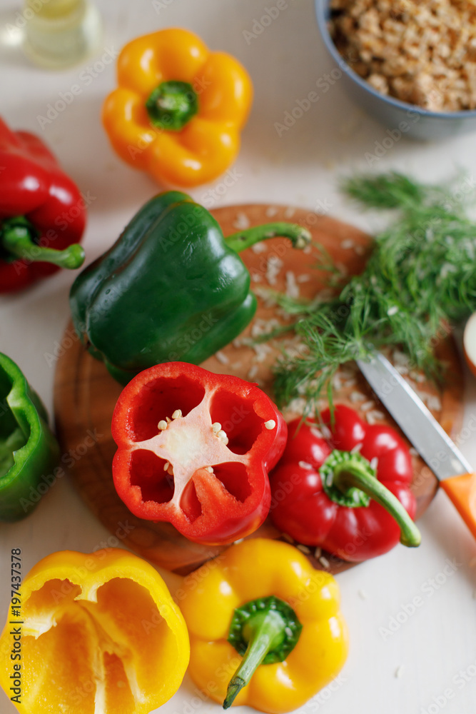 Raw colorful peppers stuffed with chopped meat and rise Raw colorful peppers stuffed with chopped meat and rise