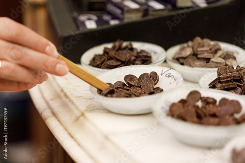 Chocolate drops in bows used as to sample the tast of chocolate 