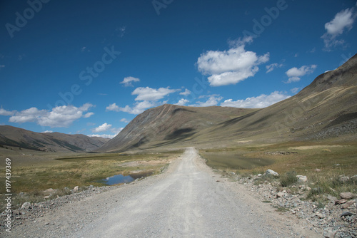 Wallpaper Mural Wildlife Altai. The road, mountains and sky with clouds in summer Torontodigital.ca