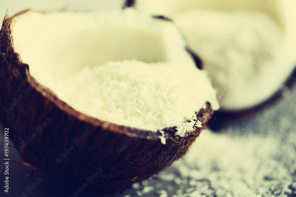 Εκτύπωση καμβά Coconut fuit halves with coconut shavings on grey concrete background