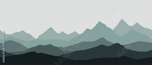 panoramic view of the mountain landscape with fog in the valley below with the alpenglow grey sky - seamless