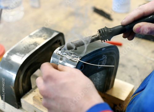 Soldering metal elements in workshop