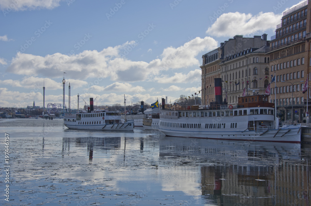Winter in Stockholm a cold and icy day with landmarks, ships and ferries at the waterfront