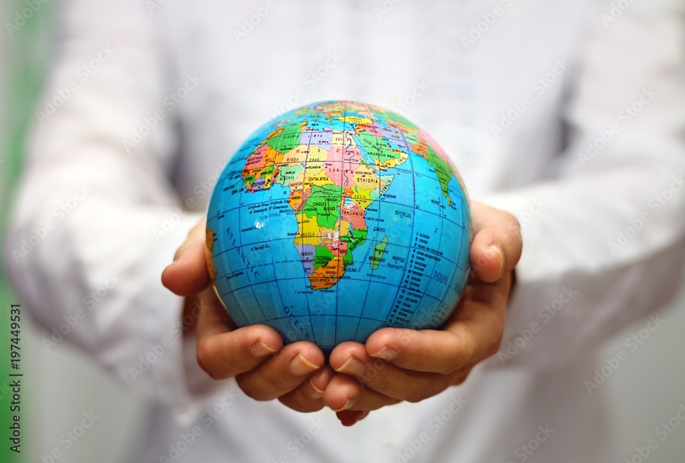 women holding world map globe on her hand women holding world map globe on her hand