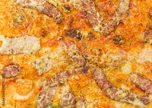 Background of pizza. Freshly prepared pizza surface close-up.