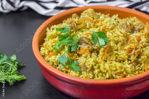 Pilaf with beef, carrots, onions, garlic, pepper and cumin. A traditional dish of Asian cuisine.