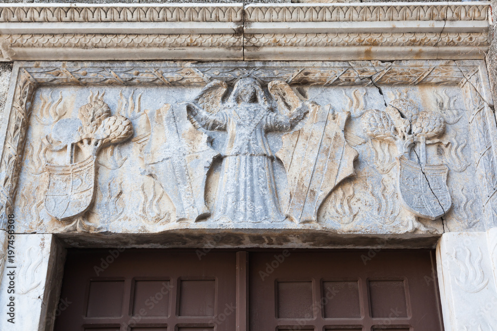 Fototapeta premium Gate-decoration with stone carvings in the city of Rhodes, Greece