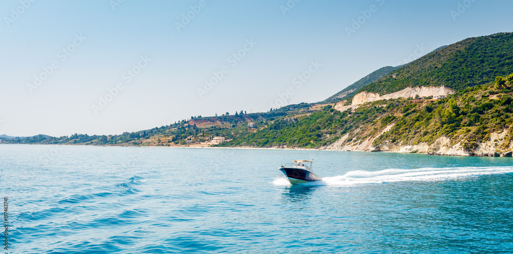 Motorboat driving on Ionian sea near Zakynthos island, Greece