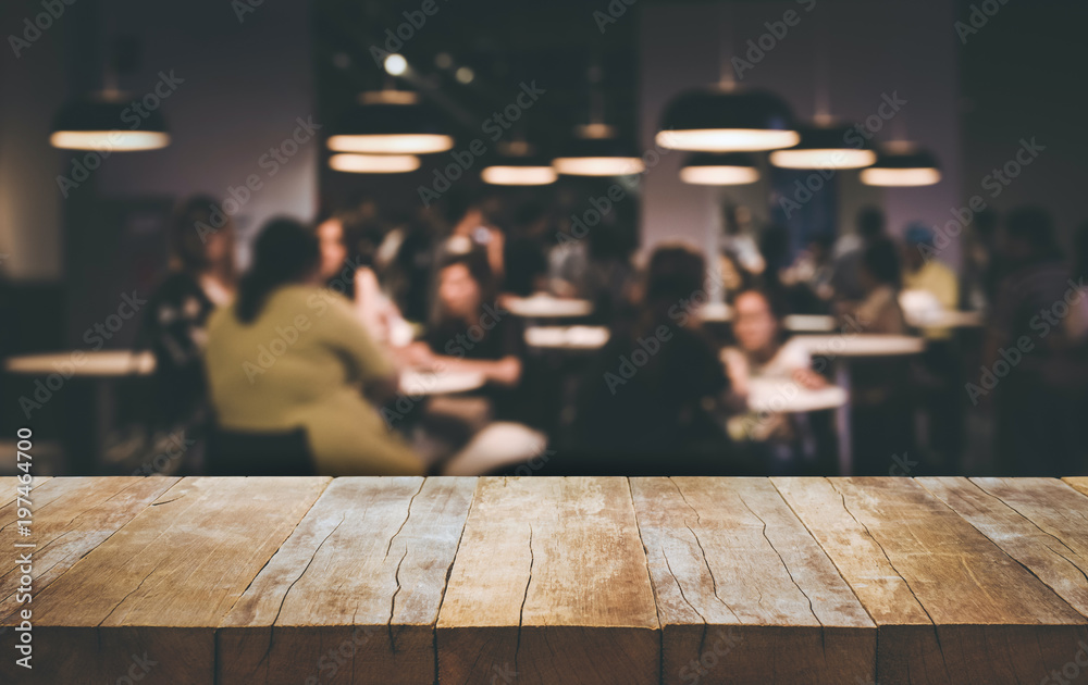 Wood table top (Bar) with blur people siting in cafe background