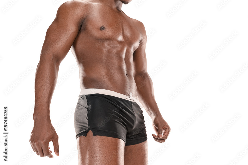 Fototapeta premium Fit young man with beautiful torso isolated on white background