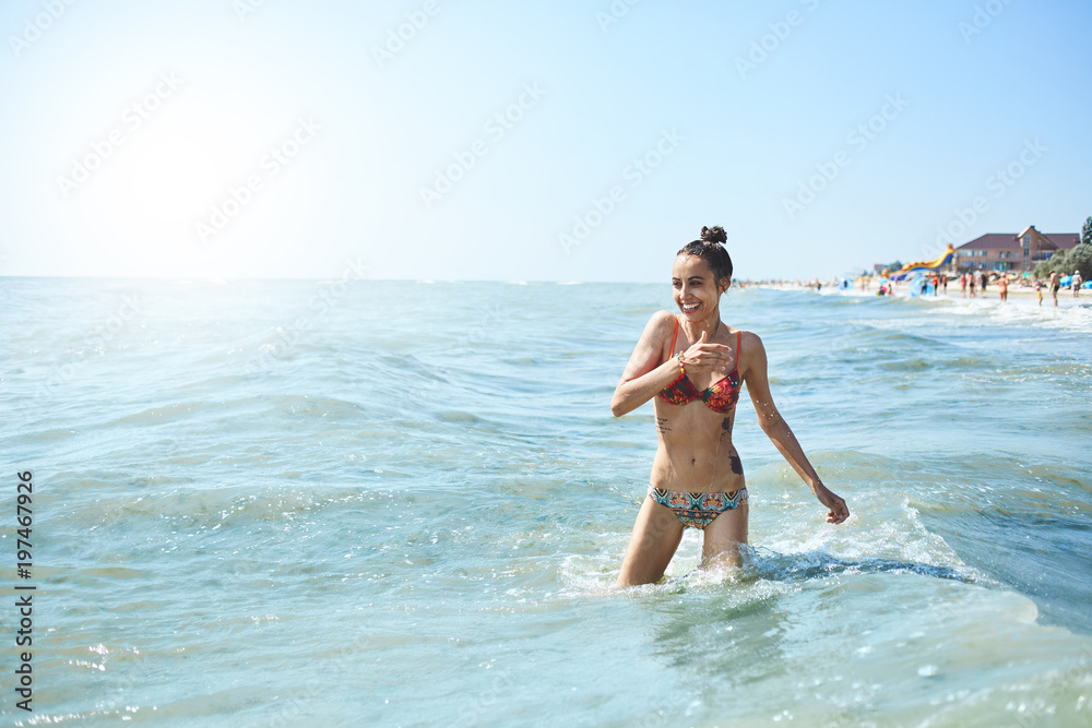 happy smiling woman is swimming in the sea happy smiling woman is swimming in the sea