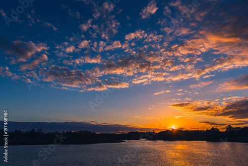 Natural sunset or sunrise over lake