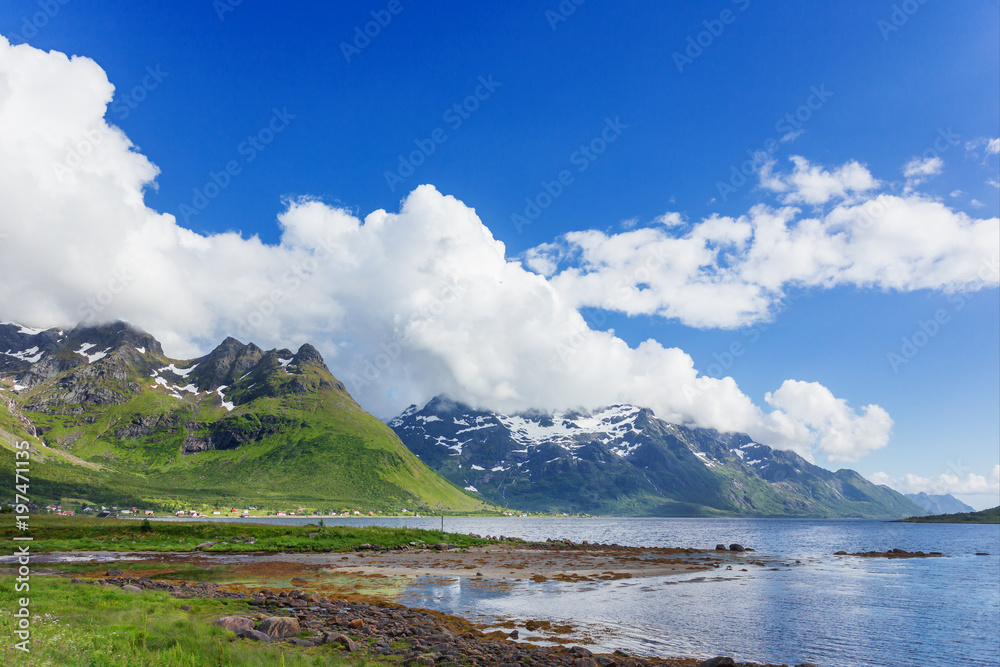 Typical scandinavian landscape with meadows, mountains and fjords. Lofoten islands, Norway.