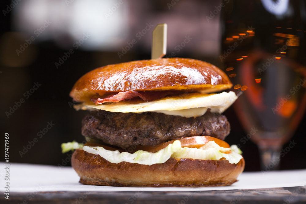 Tasty grilled prawn and beef burger with lettuce Tasty grilled prawn and beef burger with lettuce