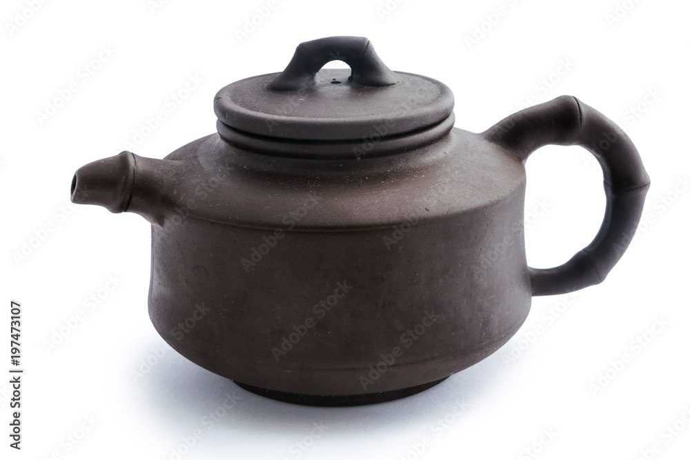 A brown ceramic Chinese tea pot isolated on white background A brown ceramic Chinese tea pot isolated on white background