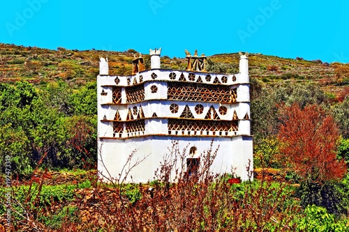 Traditional dovecote at the village of Tarambados in Tinos island, Cyclades, Greece. photo