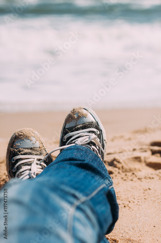 spring beach sea sneakers jeans sand