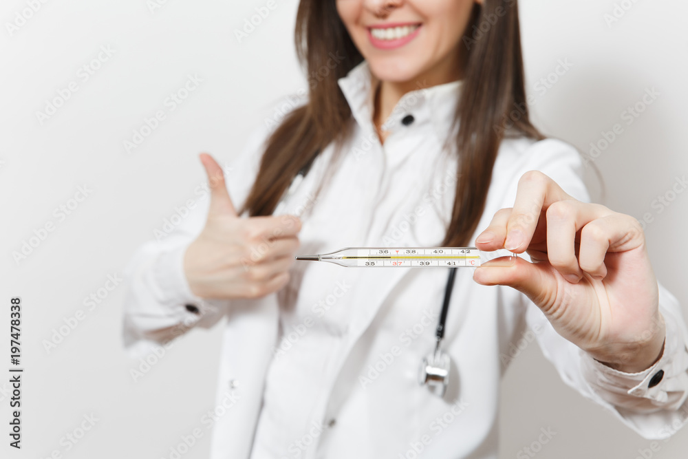 Close up cropped smiling doctor woman in medical gown with stethoscope, glasses showing thumbs up. Focus on clinical thermometer with normal temperature isolated on white background. Medicine concept. Close up cropped smiling doctor woman in medical gown with stethoscope, glasses showing thumbs up. Focus on clinical thermometer with normal temperature isolated on white background. Medicine concept.