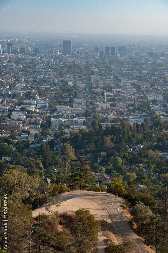 View of hiking trail overlooking a hazy evening in the city of Los angeles 